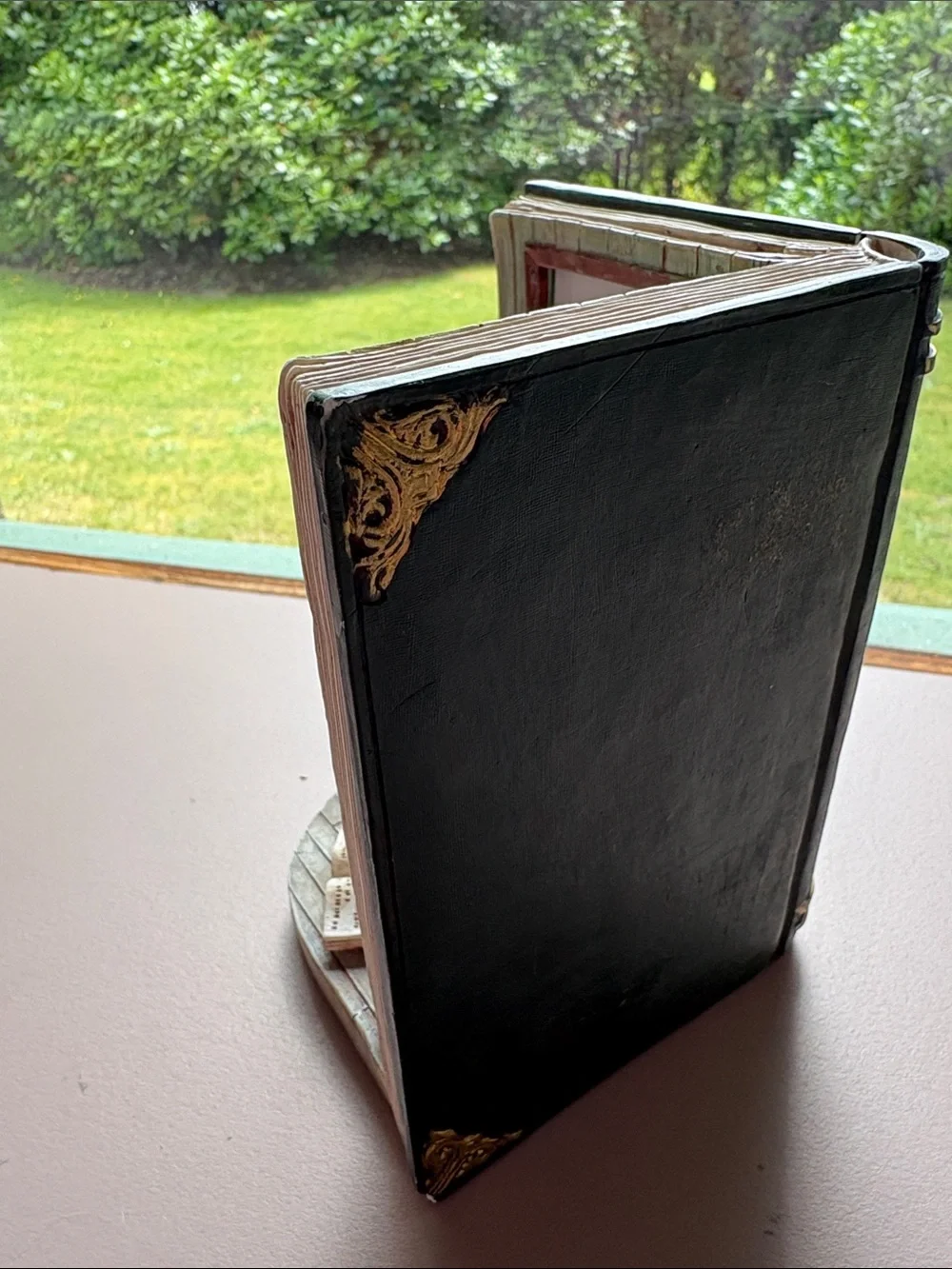 Picture frame decoration with open book and awards